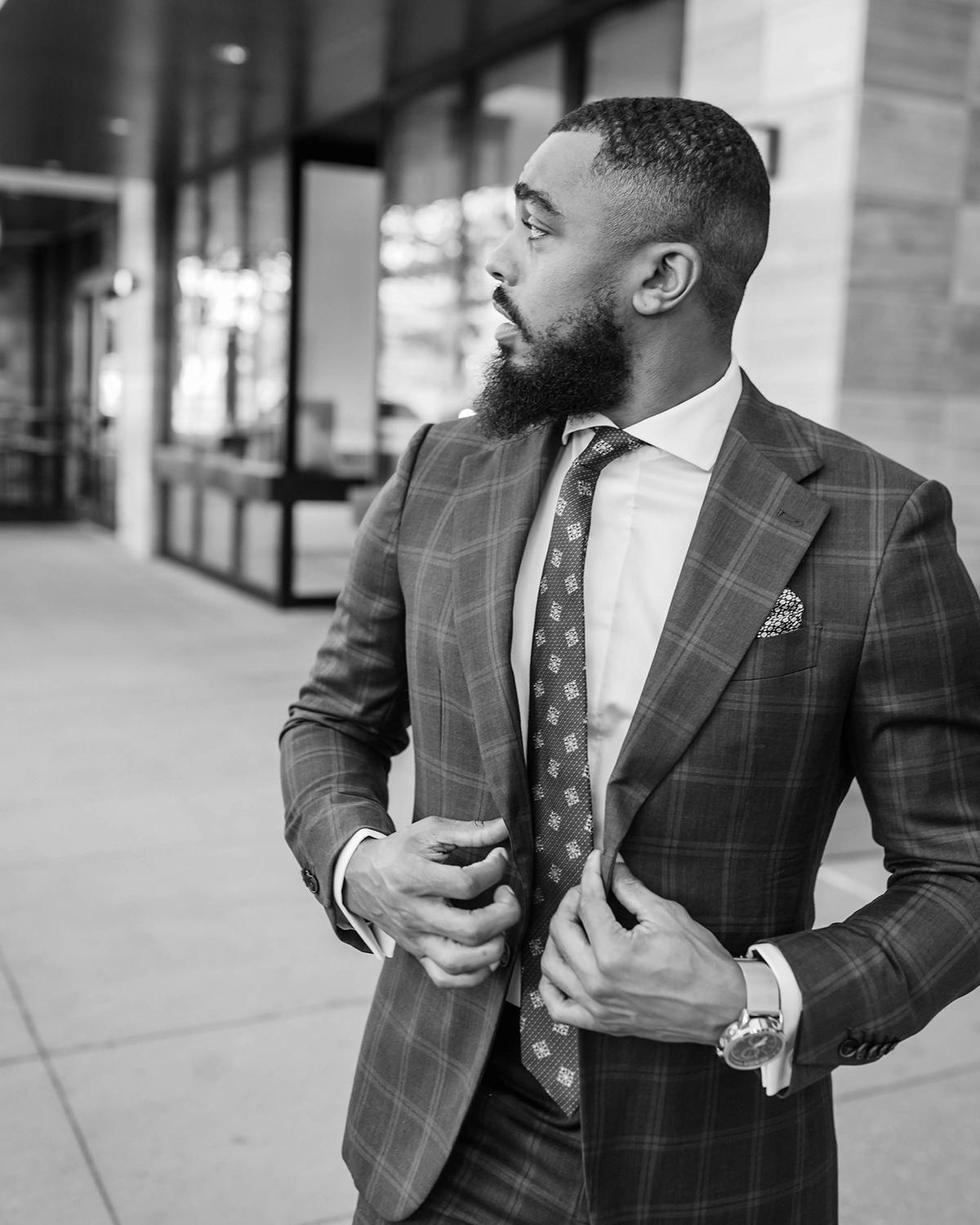 Man standing outside of Adaire tower apartments