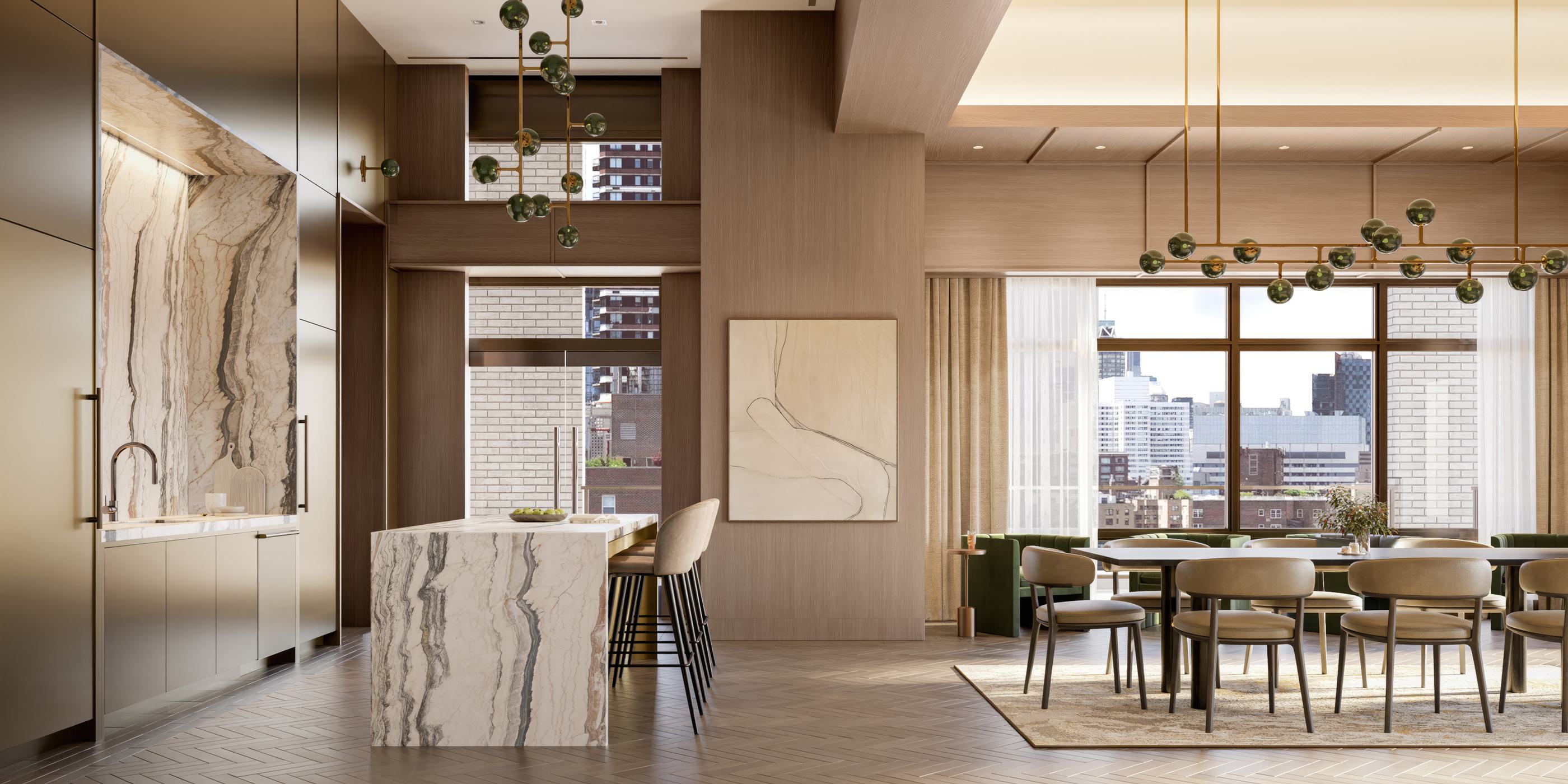 Spacious catering kitchen at Maison 78 with double-height ceilings, marble island and backsplash, modern pendant lights, and large windows facing the Upper East Side.