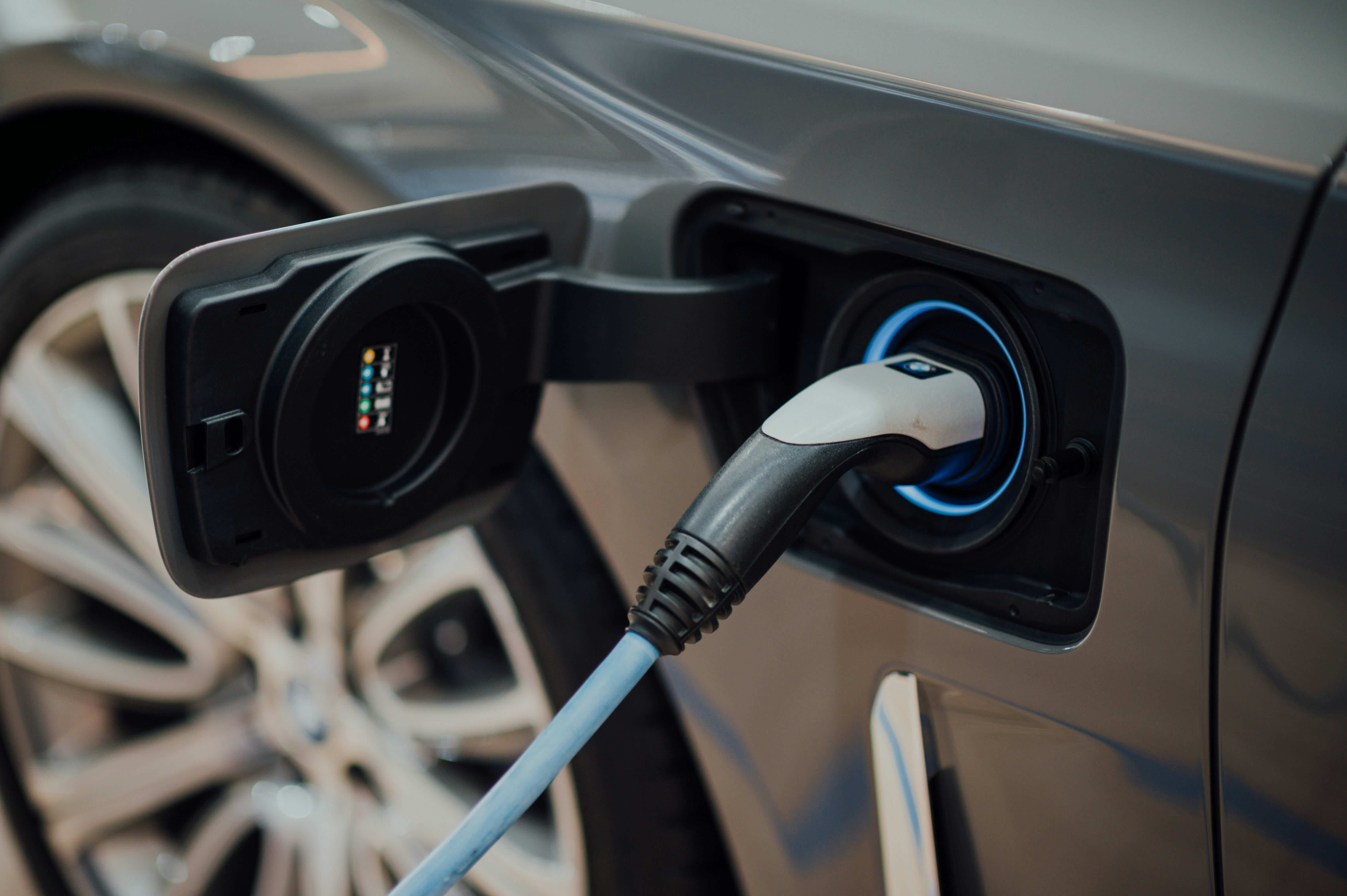 closeup of an electric vehicle being charged