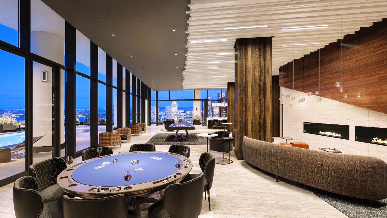 Sky Lounge at The Sudbury with game tables, modern fireplace, floor-to-ceiling windows, and panoramic nighttime views of downtown Boston.