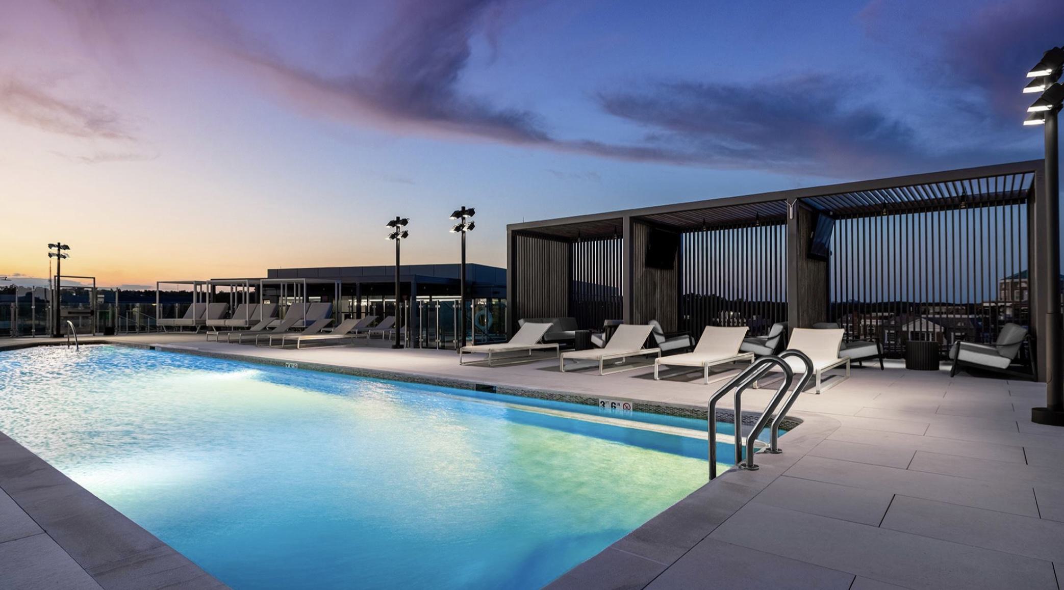 Aerie’s rooftop pool deck sits high above Woodley Park, offering glass-railed views, modern loungers, and expansive sightlines across the DC skyline.