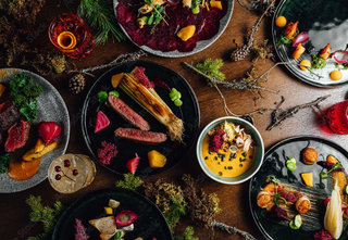 exterior of barrel and board restaurant with hand lettering on window