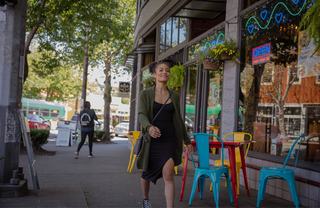 woman walking down a street in Fremont