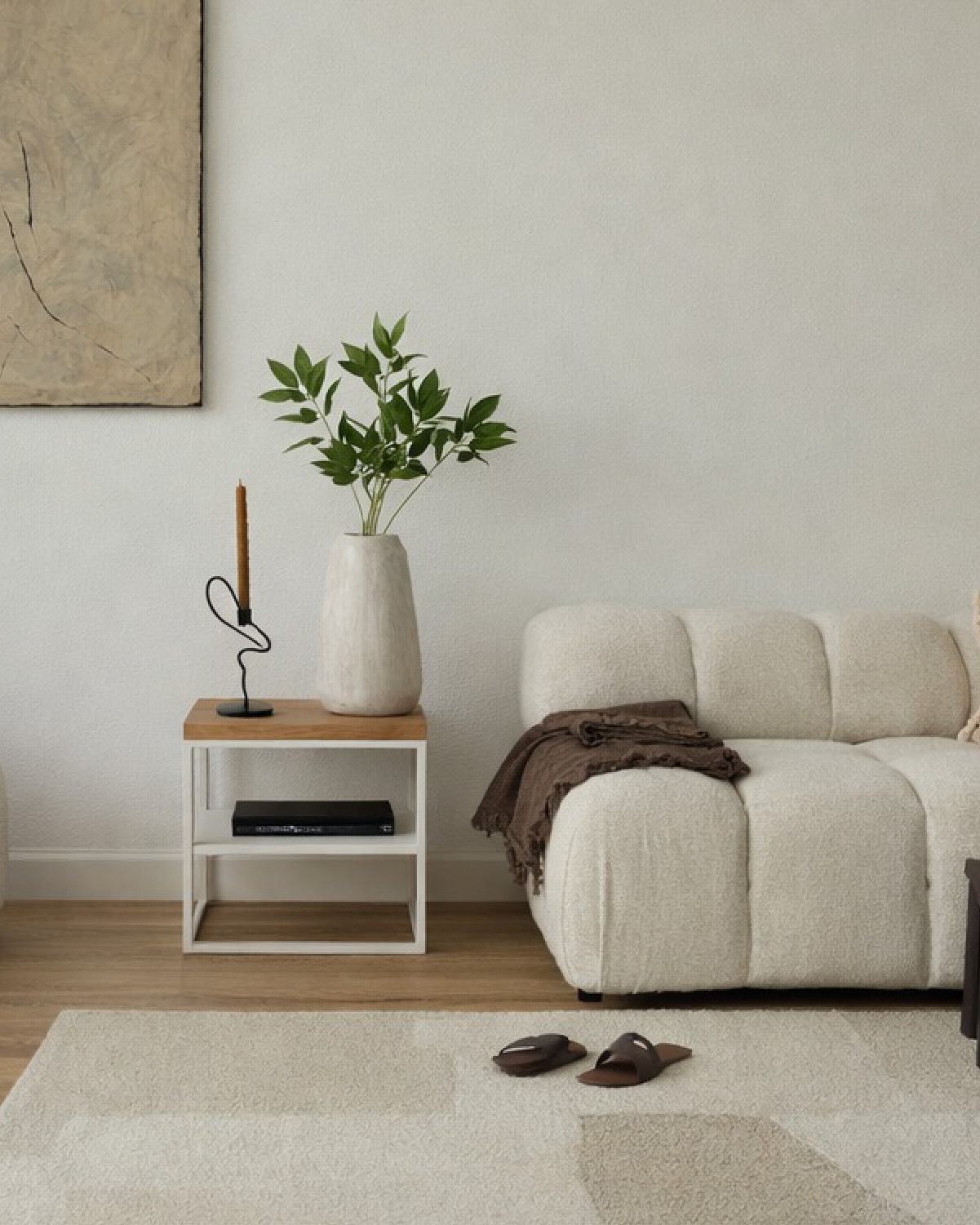 Interior view of a luxury apartment living area at The Bowden, showcasing clean lines, neutral tones, and upscale finishes in the heart of Redmond.