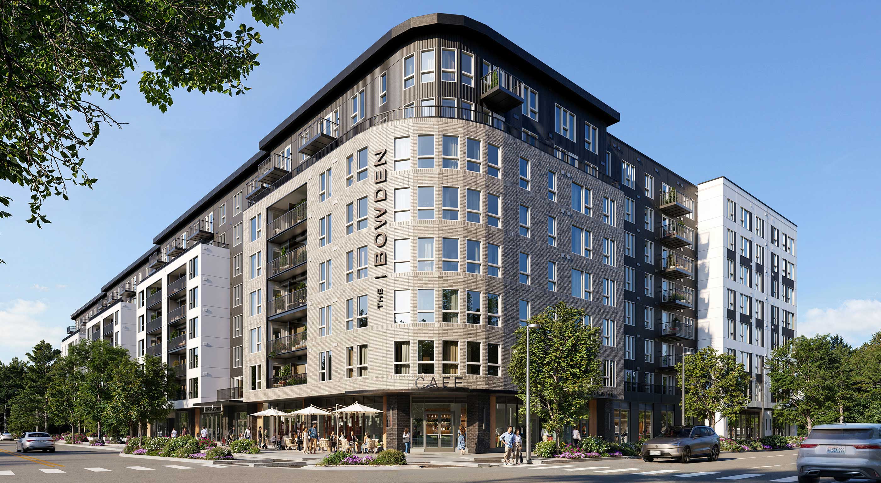 Exterior view of The Bowden, a contemporary multi-story apartment building in Redmond, WA, situated at a strategic intersection in the Bel-Red corridor.