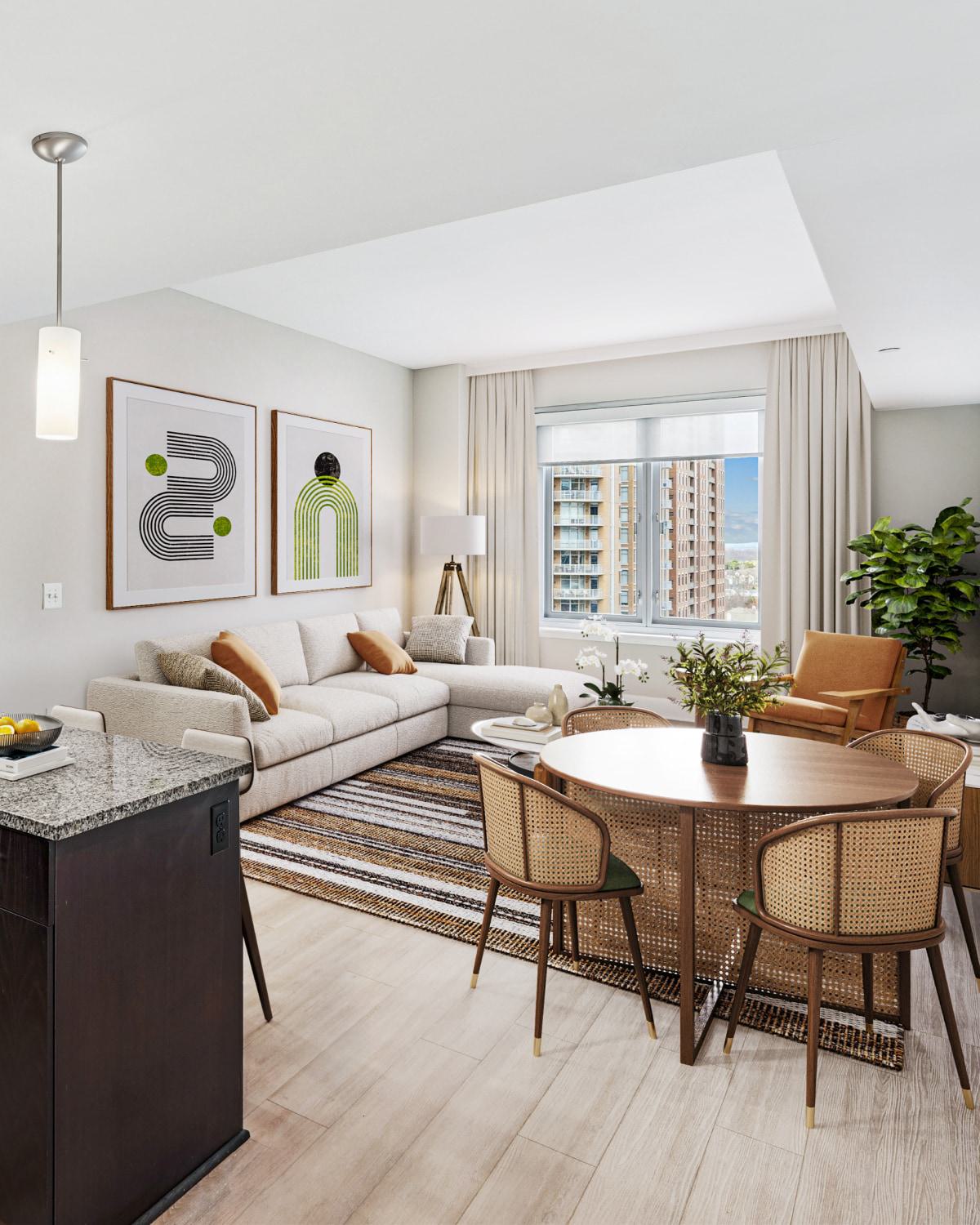 Bright, modern apartment living and dining area at Avant Reston with large windows showing a city view.