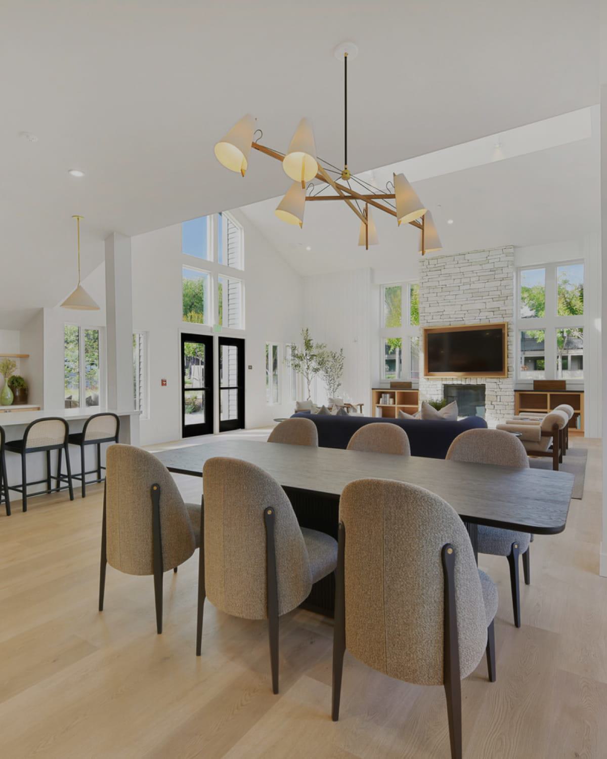 Stylish, coastal and upscale clubroom with open kitchen, fireplace and lounge seating