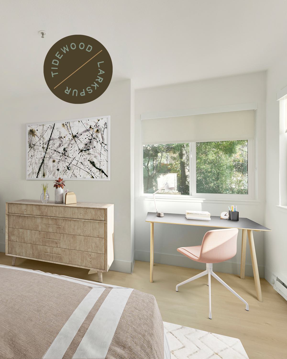 Light and airy bedroom with large window above a desk