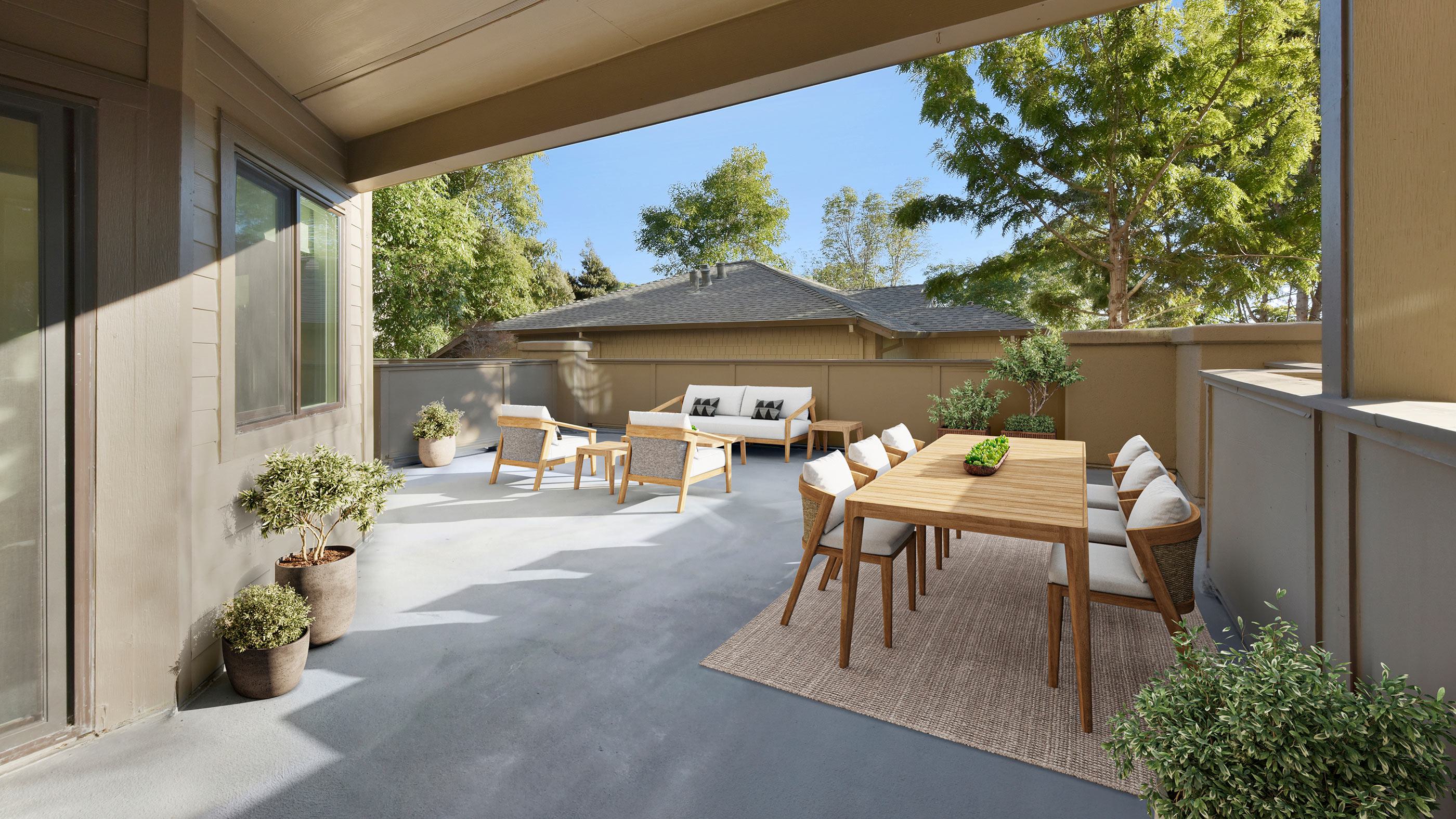 Outdoor patio with lounge furniture and landscaping