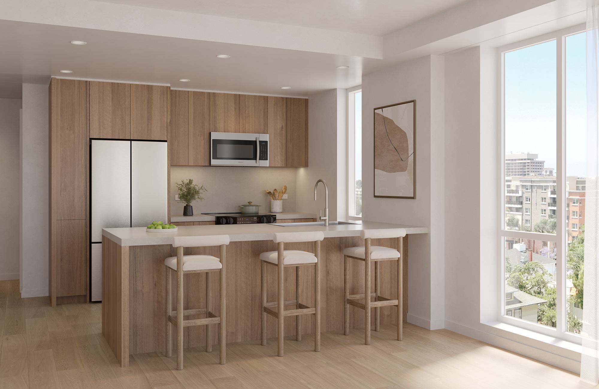 Alt text: Modern kitchen with wood-tone European cabinetry, quartz waterfall island, stainless steel appliances, and oversized windows with city views.
