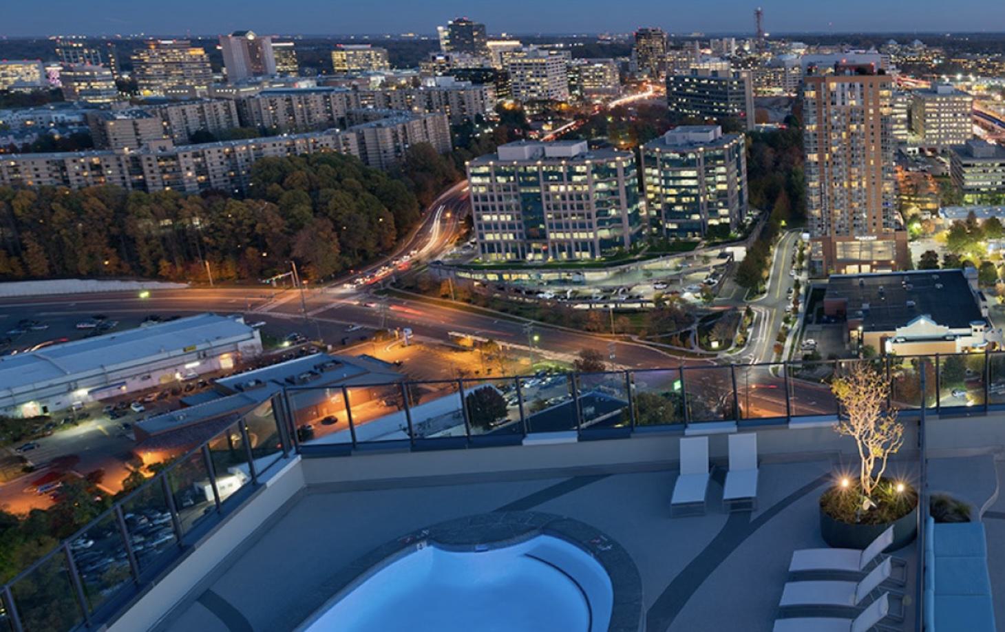 roof pool terrace at adaire, overlooking the tysons va skyline at night