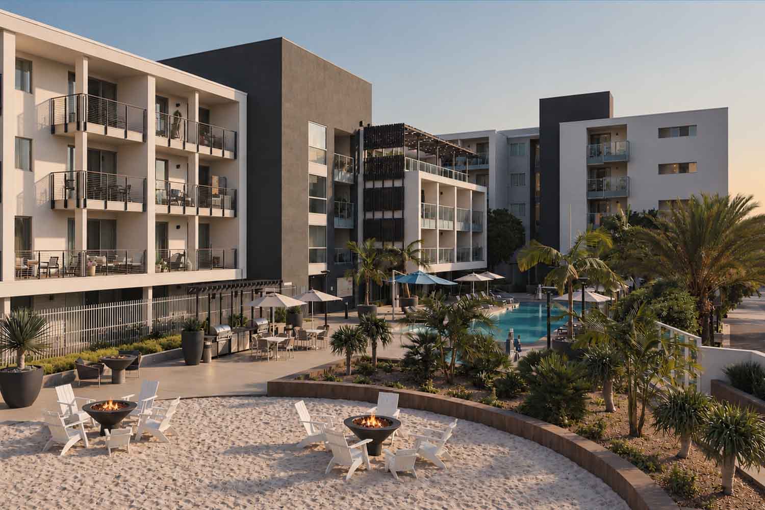Twilight architectural rendering of the Stella apartment complex featuring a pool deck, fire pit lounge, and surrounding modern buildings.