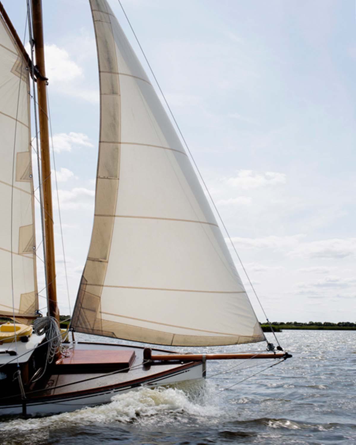 A sailboat on the water, representing harborside living in Marina del Rey
