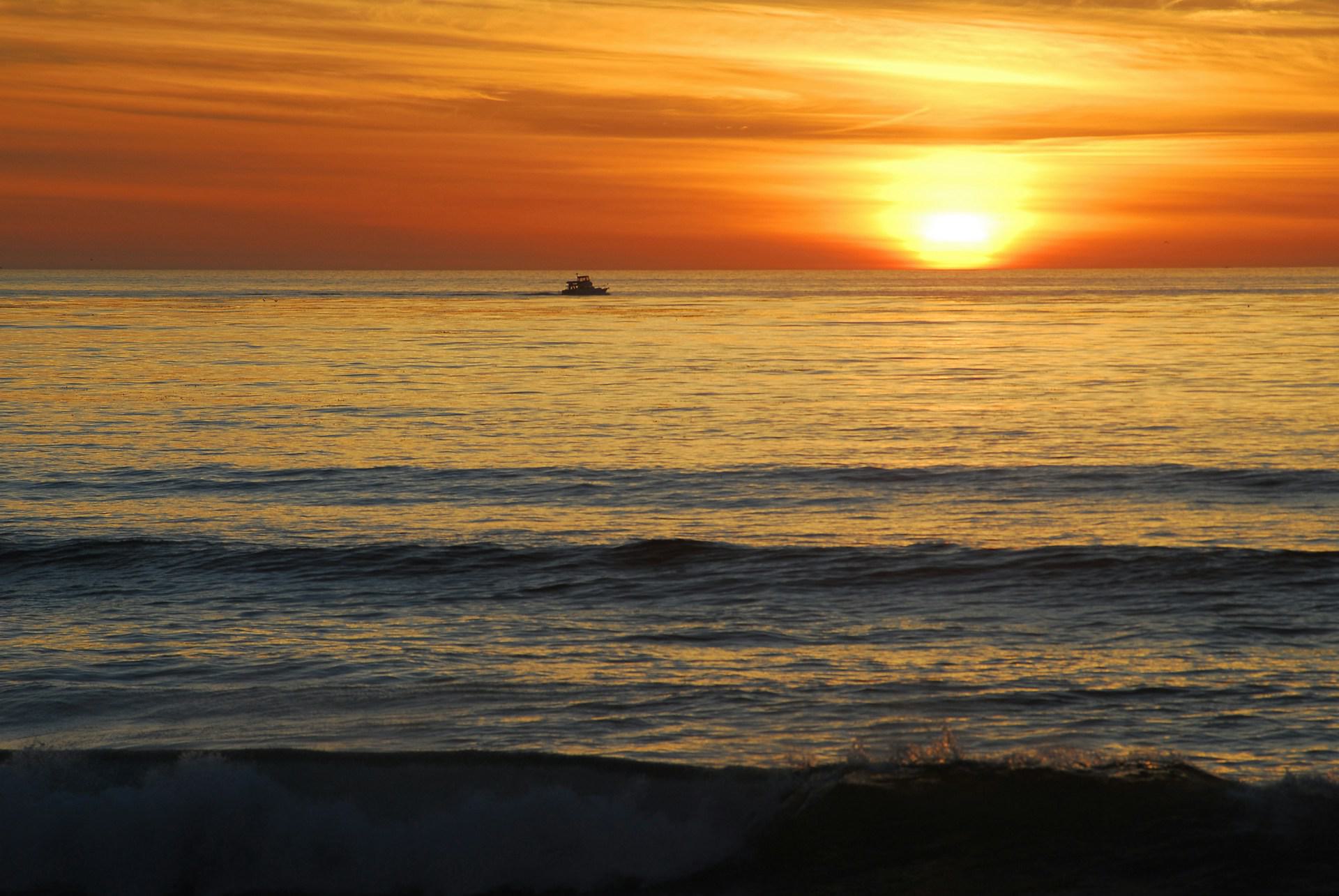 a dramatic sunset on ocean beach