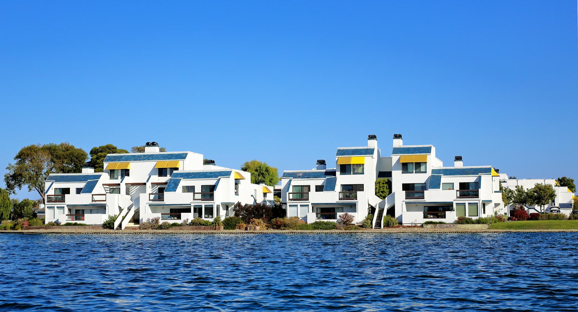 the foster city lagoon's tranquil waters against a residential development