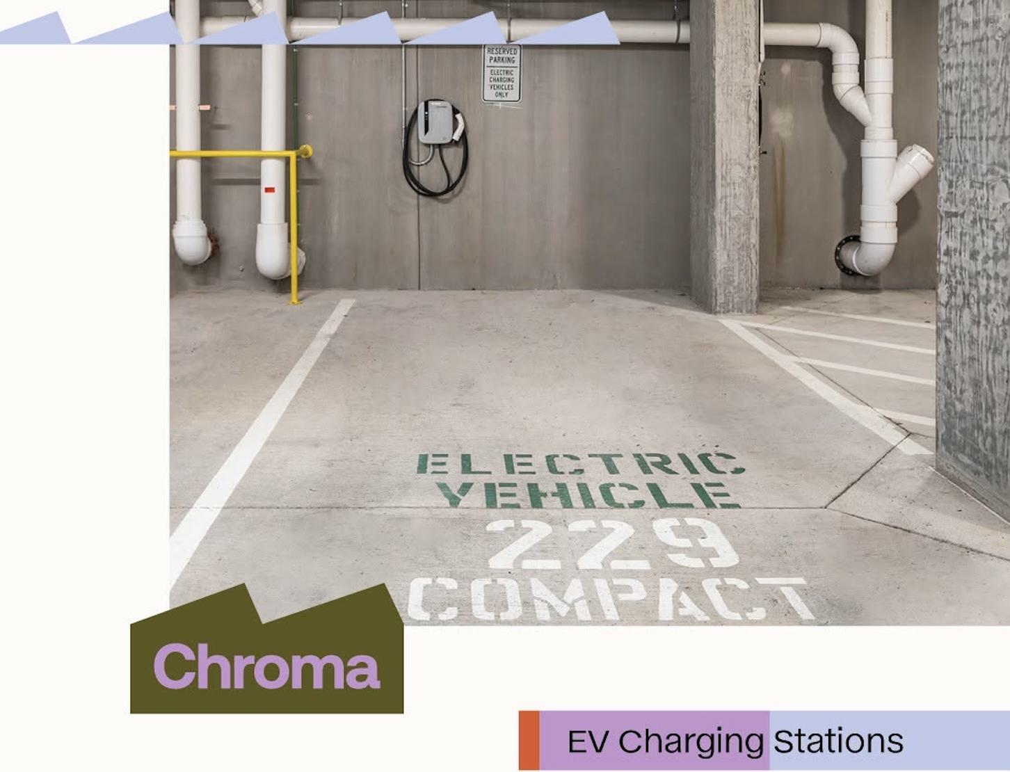 An underground parking space at Chroma featuring a wall-mounted EV charging station, a "Reserved Parking" sign, and "Electric Vehicle 229 Compact" stenciled on the concrete floor.