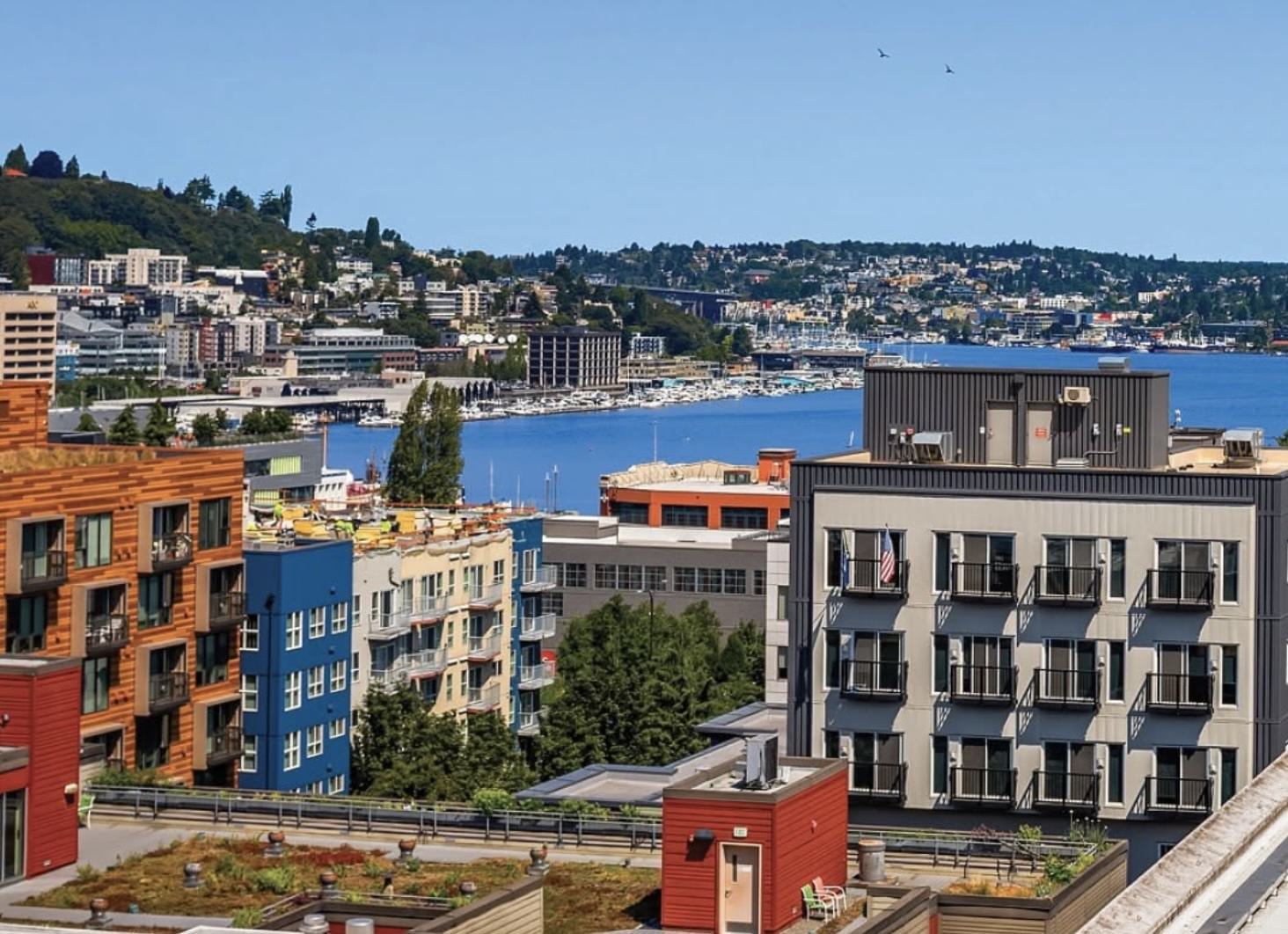 Rooftop view of Chroma SLU apartments and colorful surrounding buildings overlooking Lake Union in Seattle.