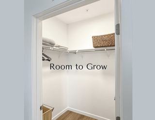 A spacious, bright walk-in closet at The Cline with built-in wire shelving, a wicker basket, and wood flooring, featuring text overlay that reads "Room to Grow."