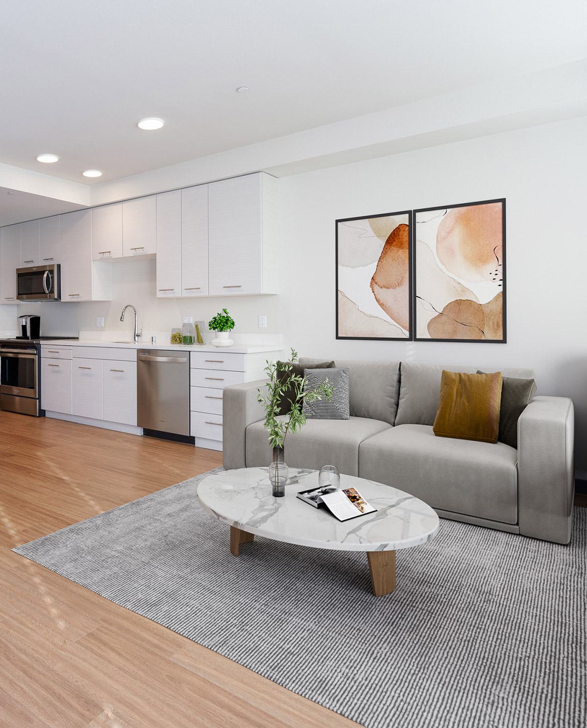 Modern apartment living room and open-concept kitchen with plank flooring at Silver Apartments in San Jose, California