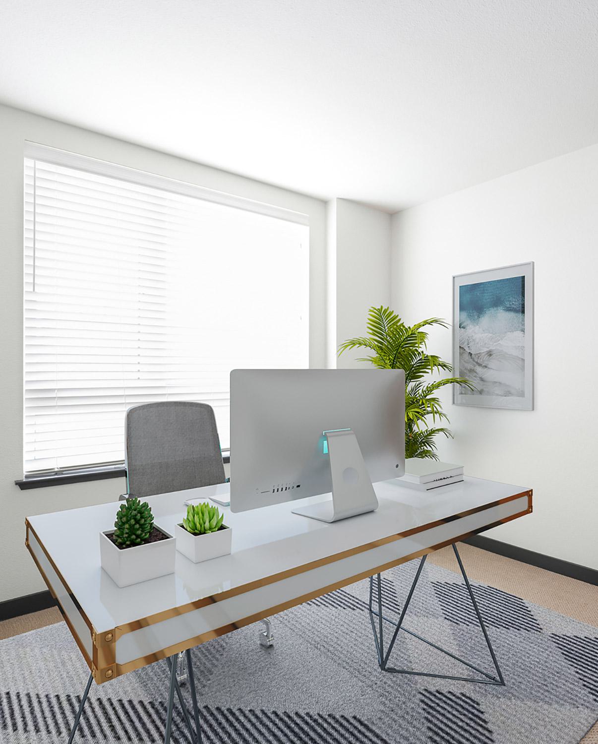 Modern apartment with large windows and a home office setup