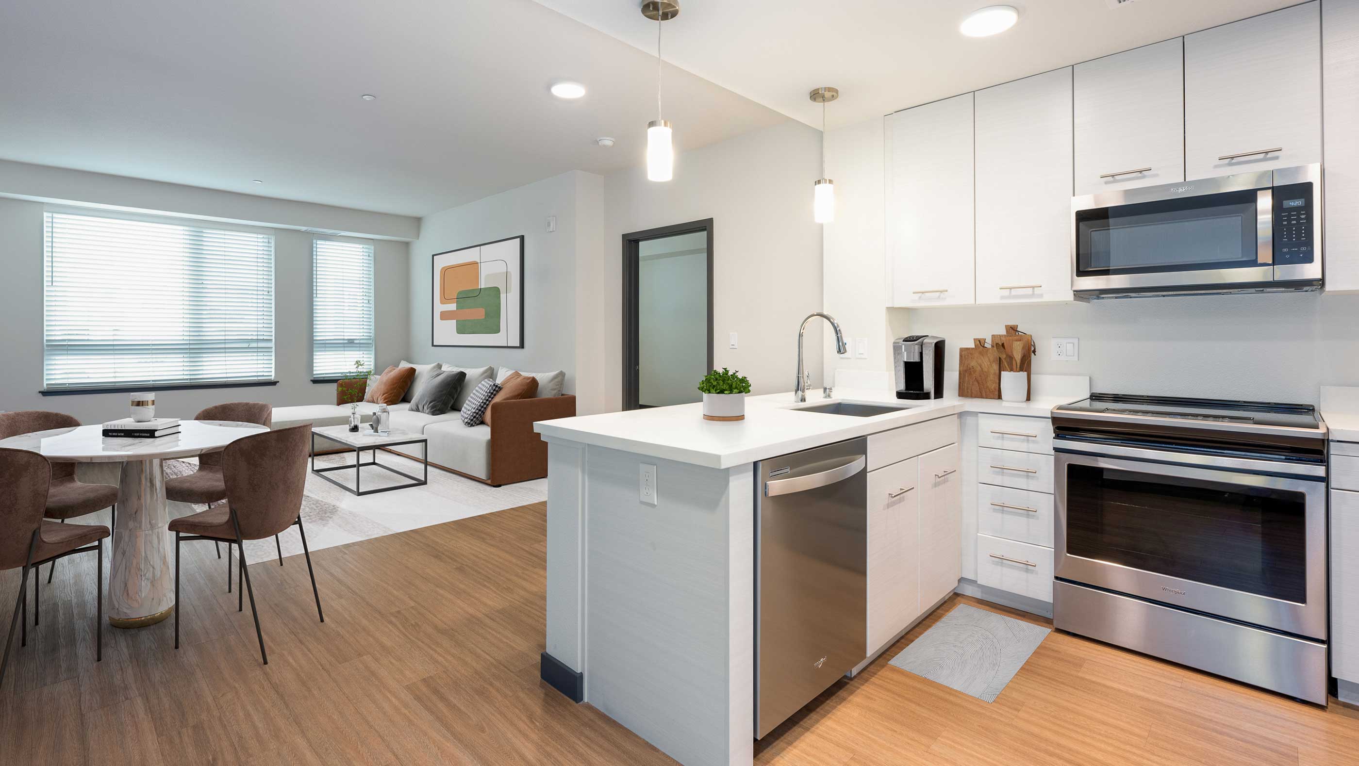 modern kitchen and living area with oversized windows