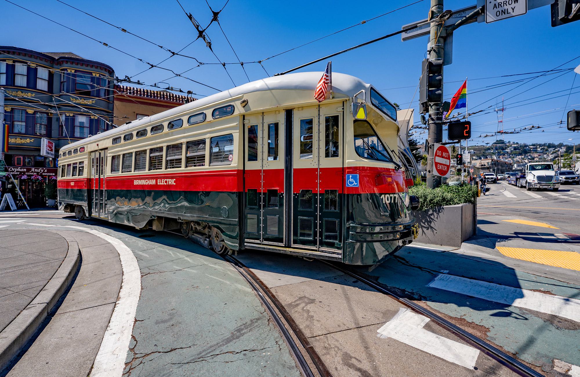 A historic streetcar from the F Market & Wharves line, taken at 17th Street & Castro Street near Alchemy. You can see Orphan Andy's diner in the background on the far left and Twin Peaks in the distance.