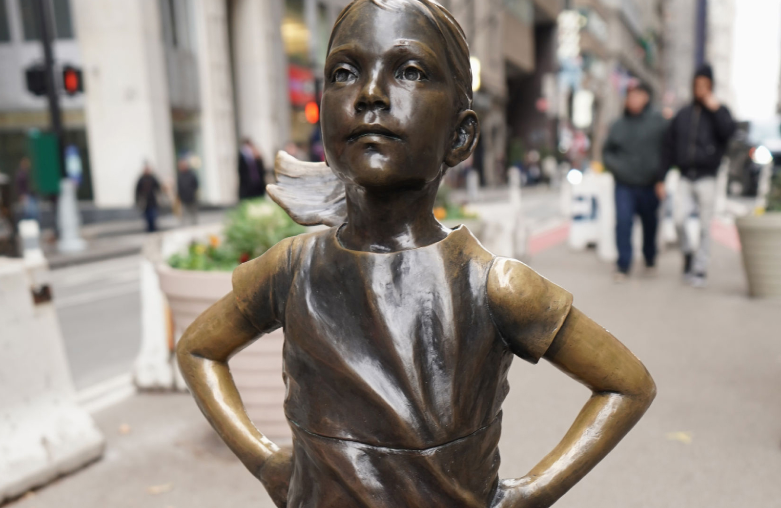 close up of The Beloved Fearless Girl Statue face - 19 Dutch manhattan apts