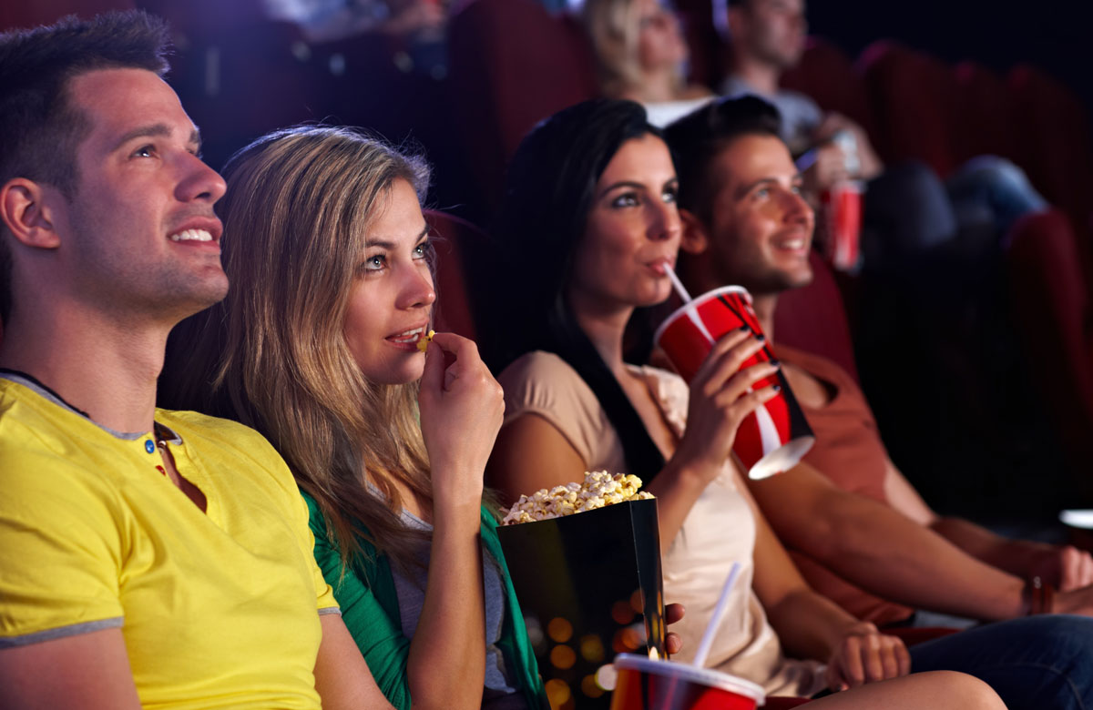 4 friends at a movie theatre - The Madrid Westchester LA Neighborhood
