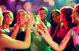 6 women and one man toasting champagne on new year's eve - 15 Cliff luxury buildings in NYC