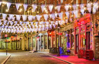 Stone Street. Cobblestone road with a row of pubs.
