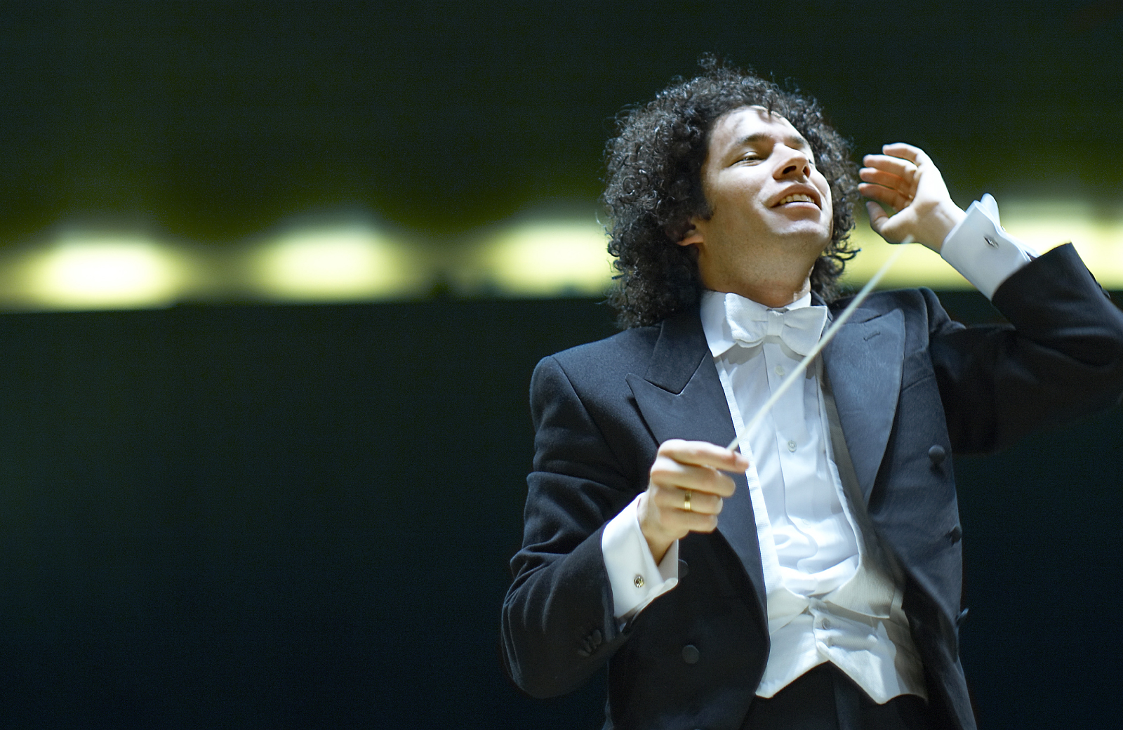 conductor leading an orchestra