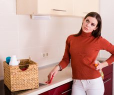 woman cleaning kitchen Upper East