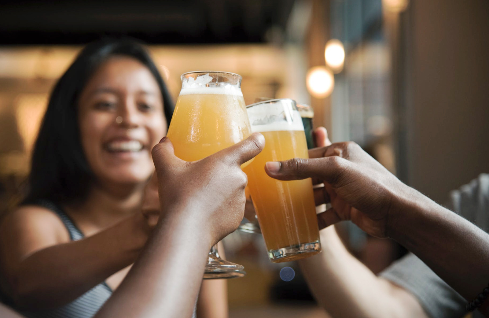 friends celebrating with beers