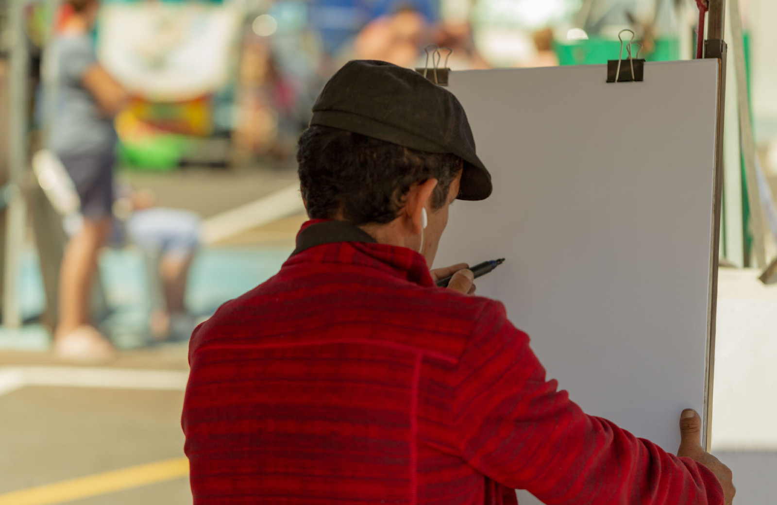 artist drawing on a canvas hyde square bellevue wa