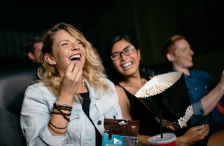 Friends Watching a Movie and Eating Popcorn
