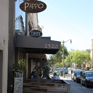 Alameda storefronts, including Pappo and Troy Greek Cuisine signs.
