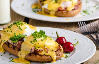 Eggs Benedict on white plate