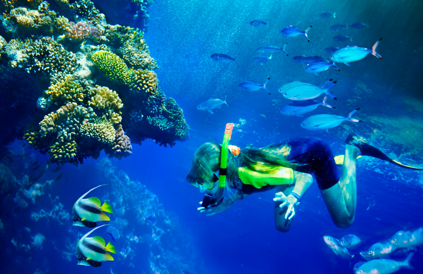 woman snorkling in hawaii kapilina