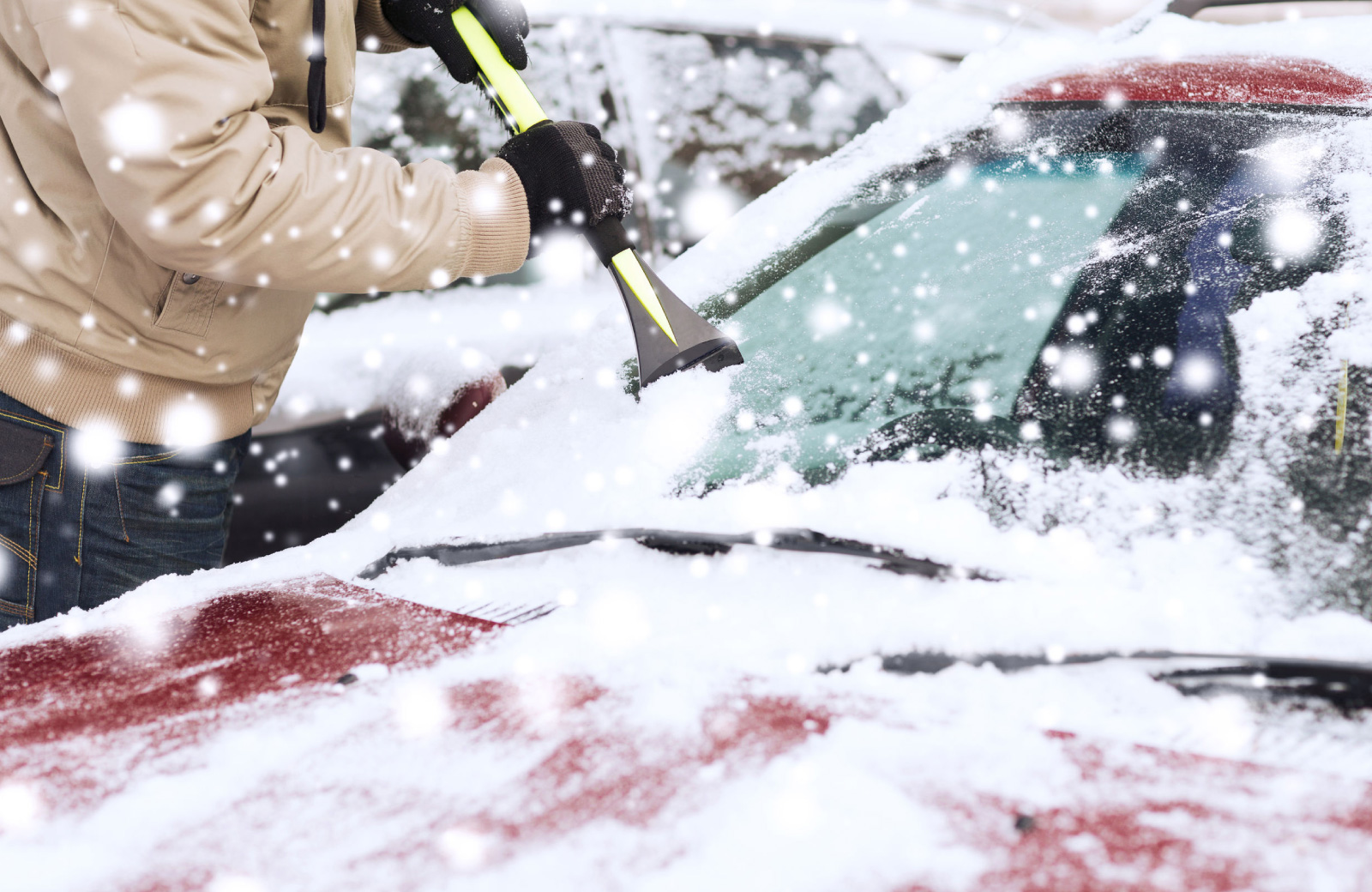 man removing snow from his car the henry denver