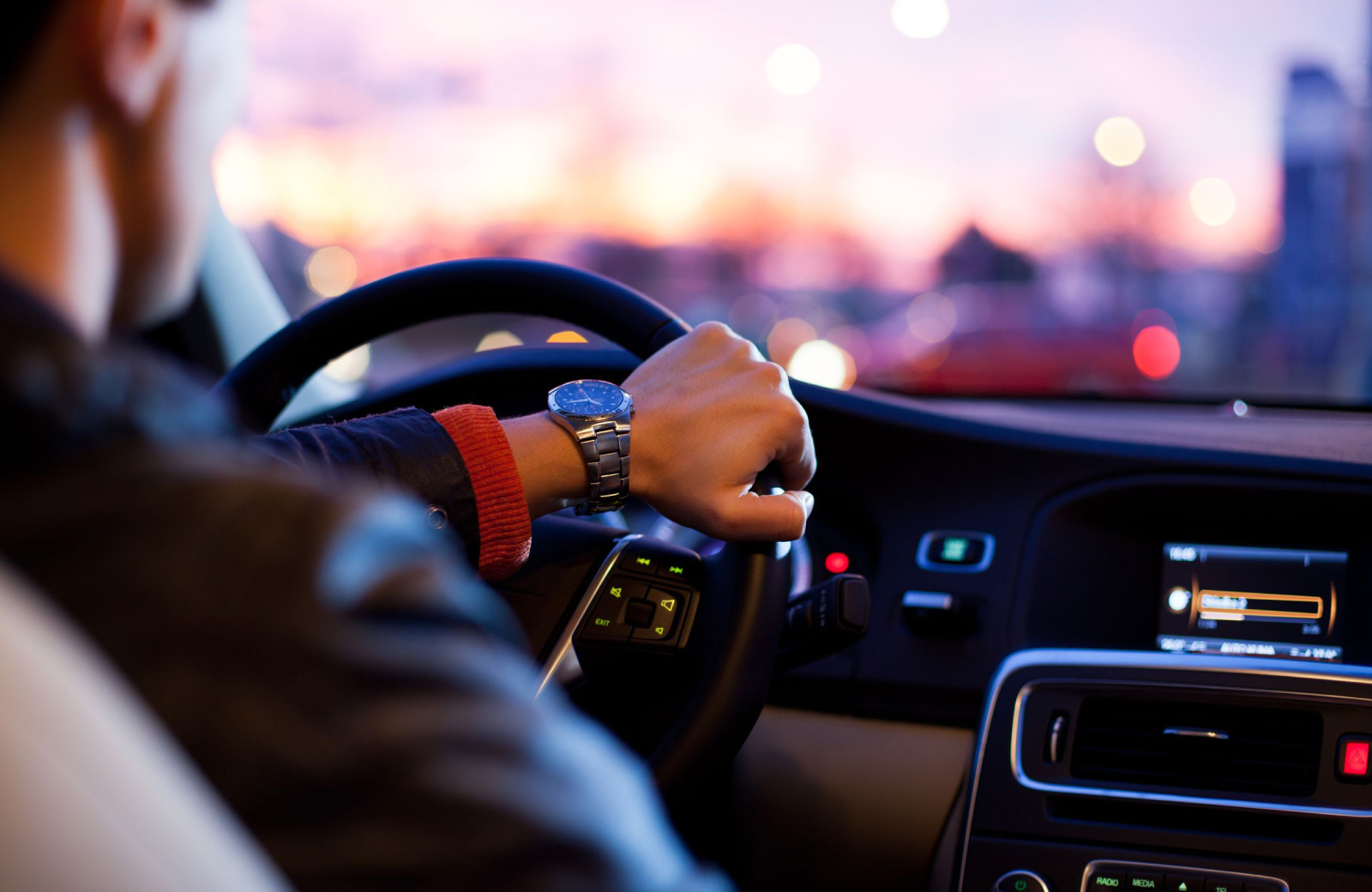 man driving car