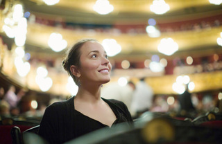 young woman in a theater