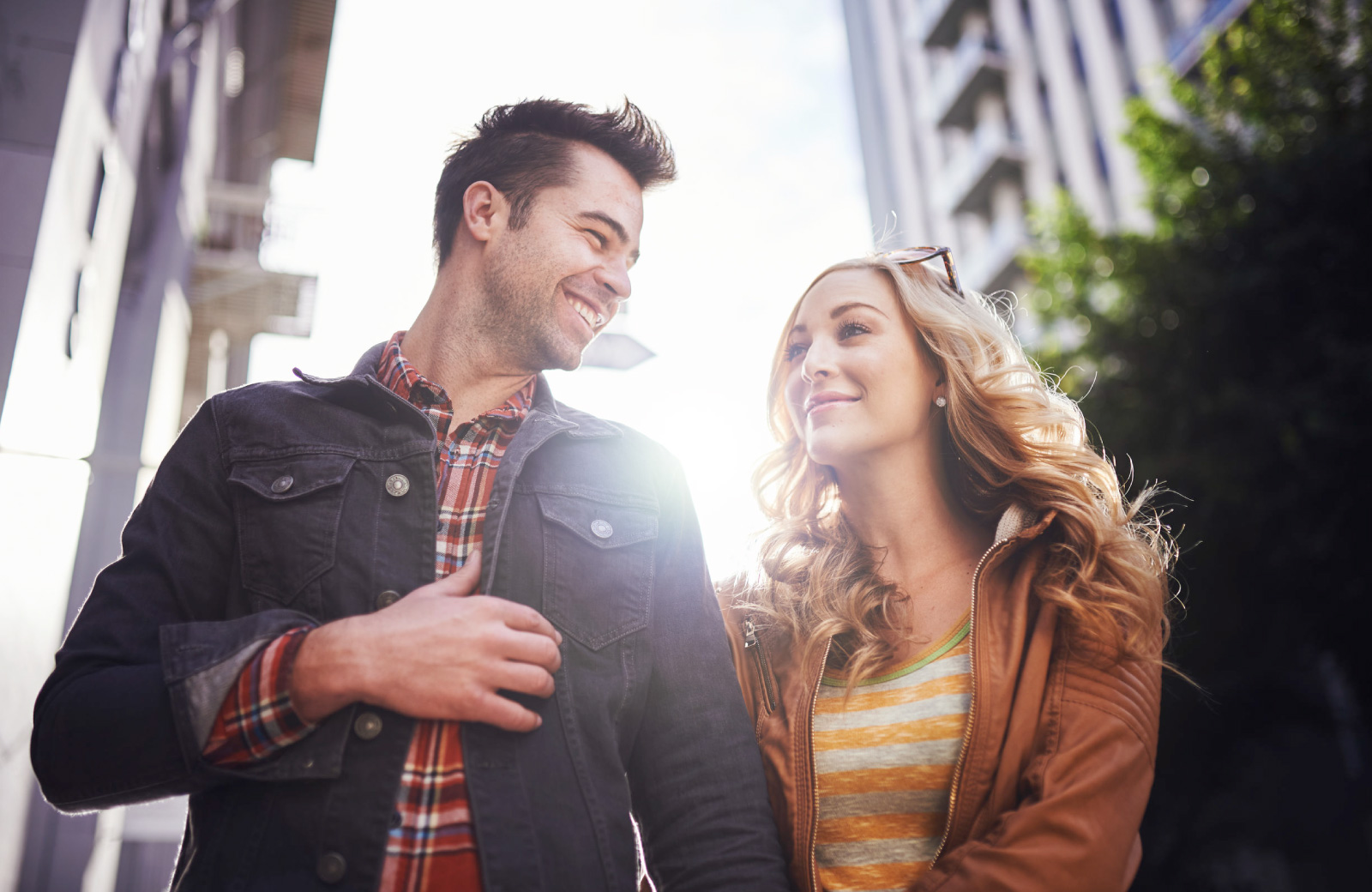 couple happily strolling along the street