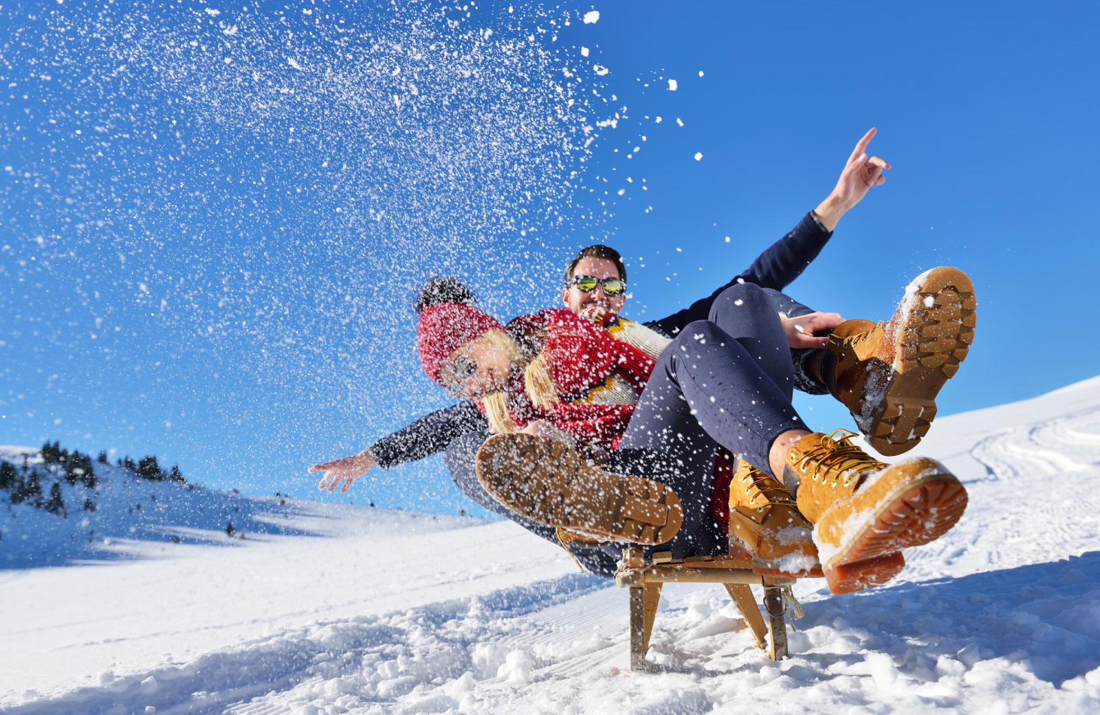 couple frolicking in the snow