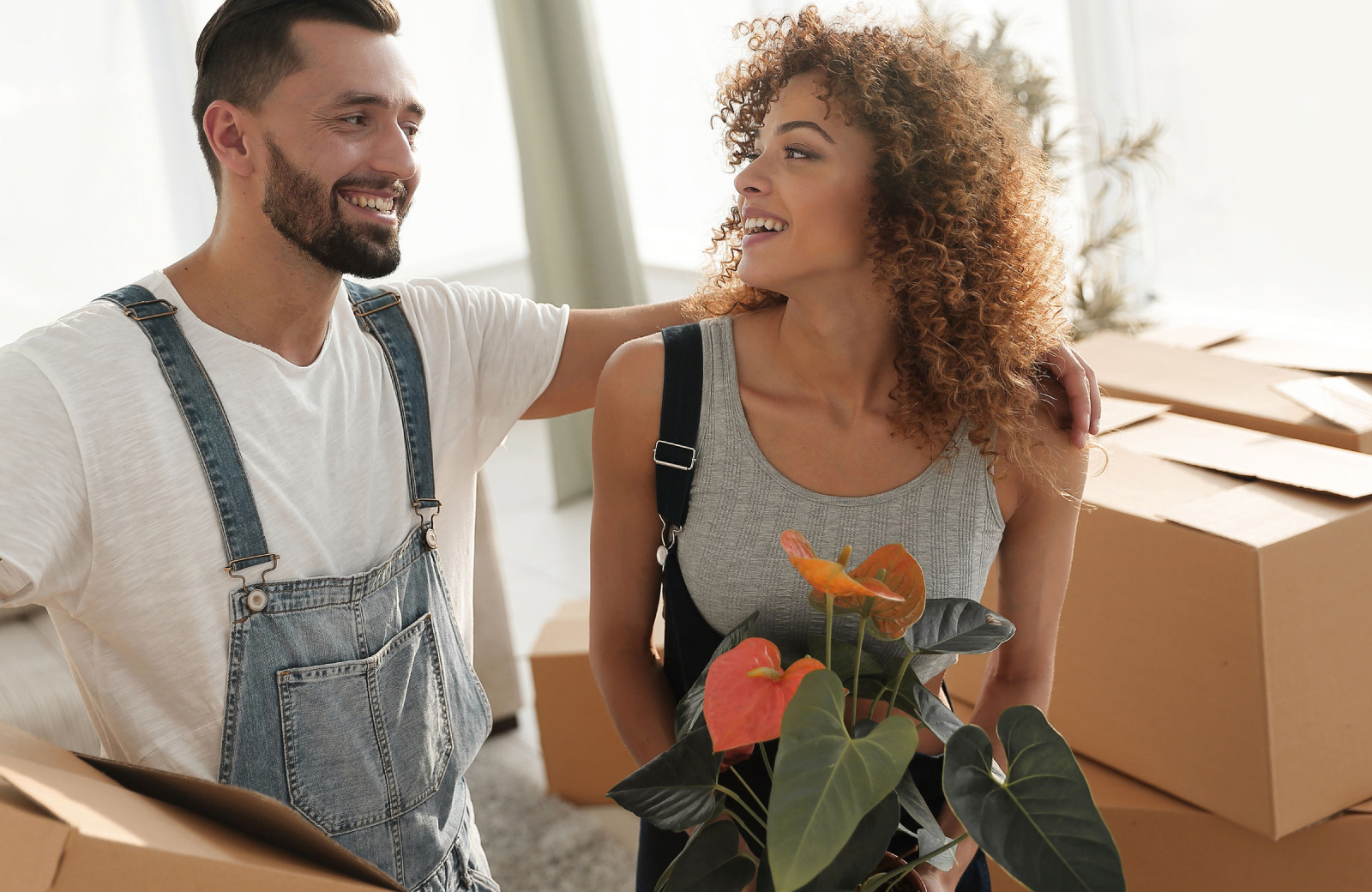 couple in new house with unpacked boxes