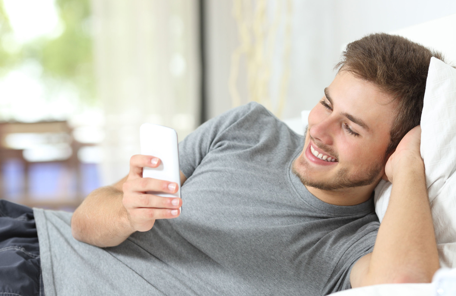 guy checking out tweets on his phone