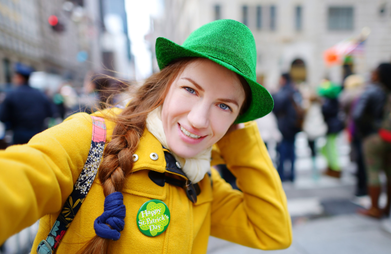 woman taking a selfie while in a parade