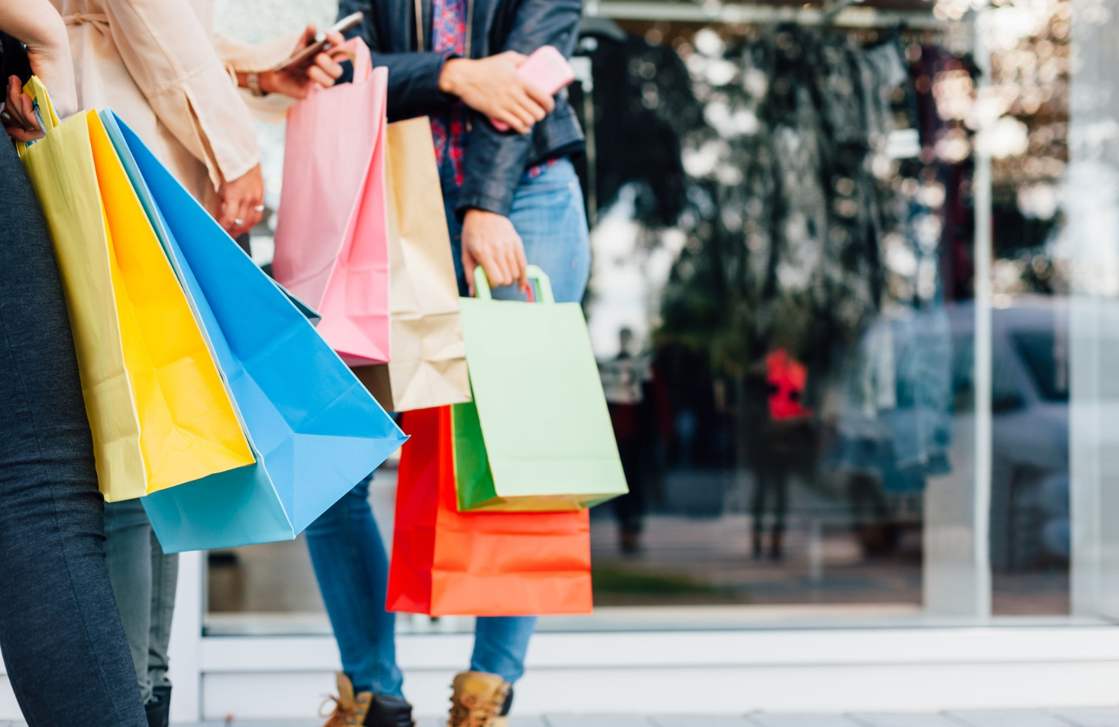women carrying shopping bags