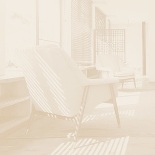 A washed out, sepia-tone image of a modern chair