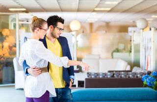 A couple furniture shopping