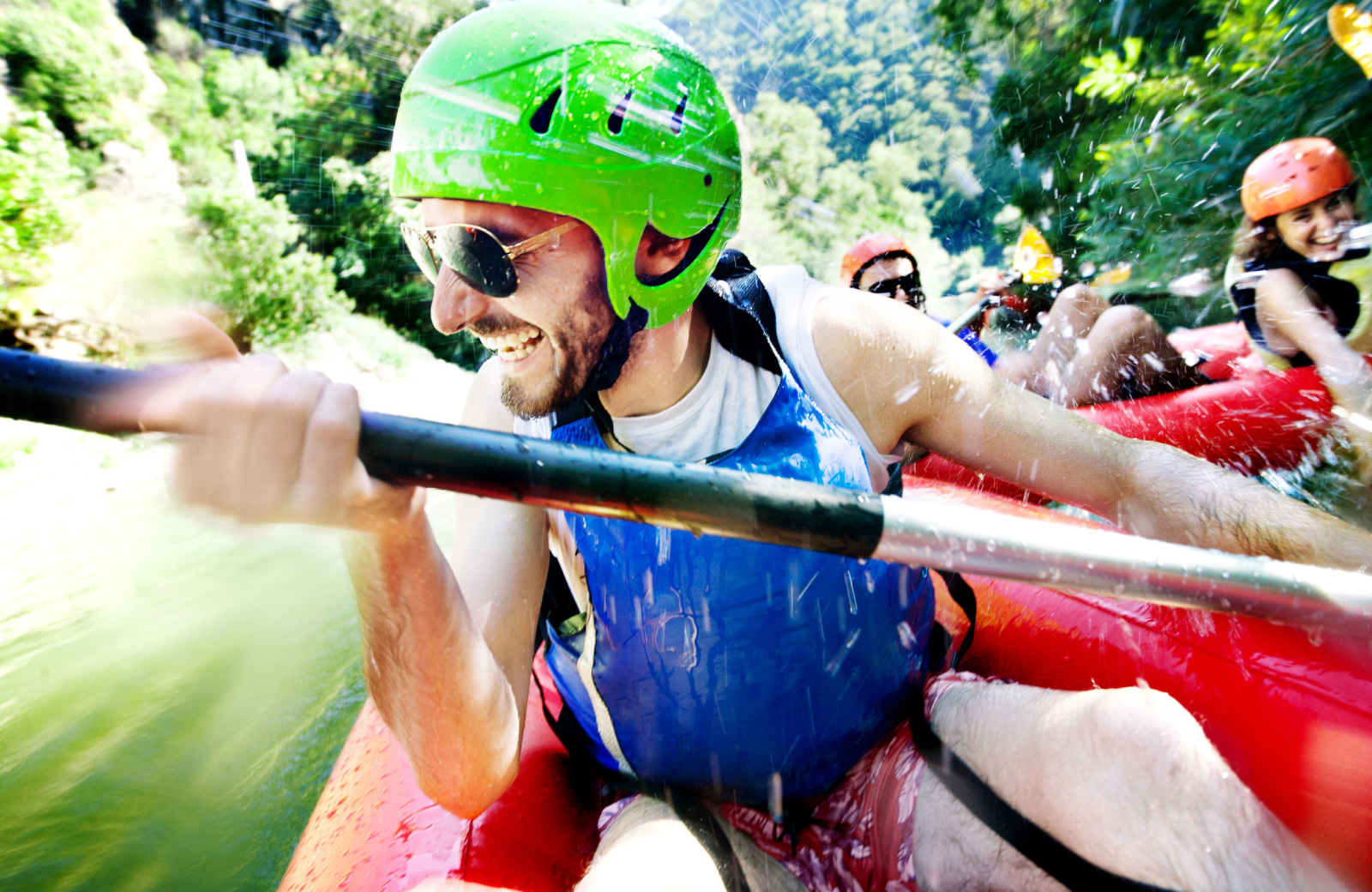 group of friends white water rafting